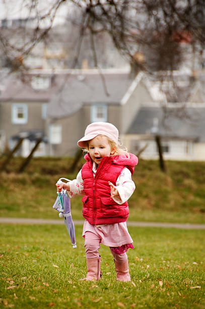 istock little girl in the park on a spring day 172869285