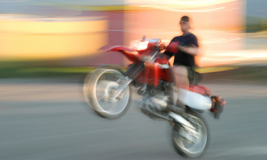 Motion blur throughout the image - nothing sharp. Feeling of speed and vibrant colors.