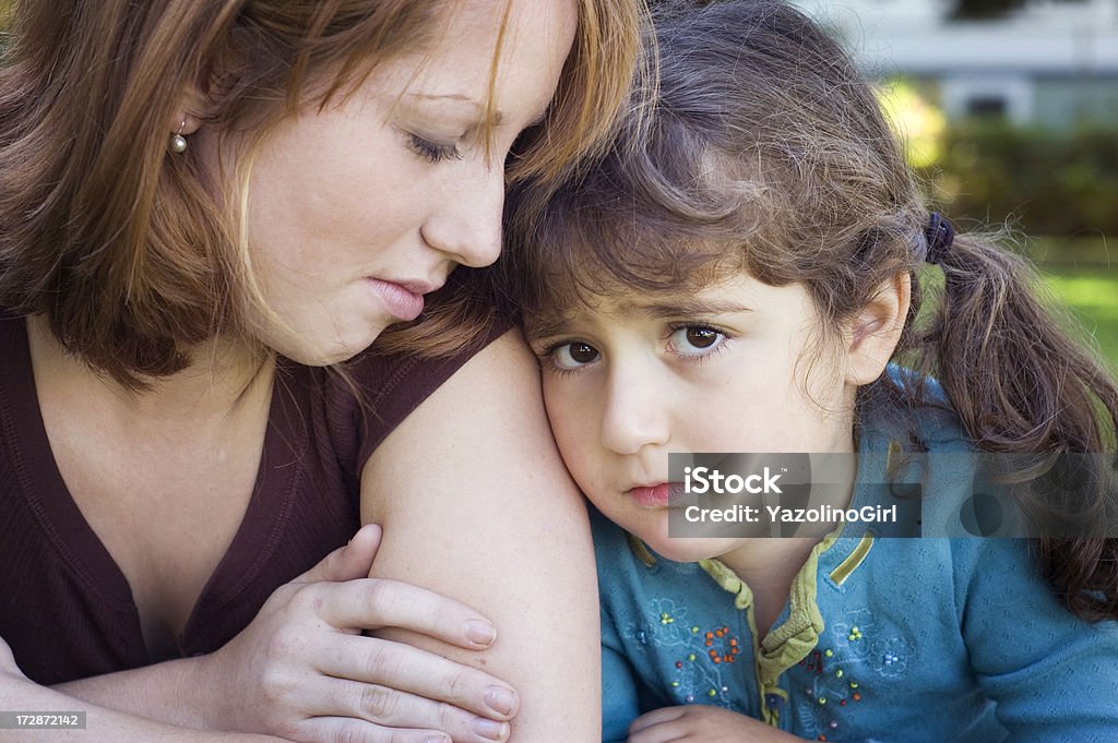 Feeling Sad (series) Sisters or young mother with daughter feeling sad and/or shy. Comfortable Stock Photo