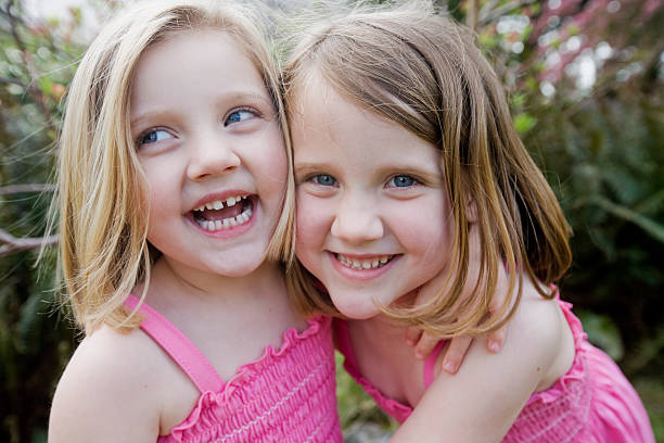 Happy sisters Happy sisters child laughing hysterically stock pictures, royalty-free photos & images