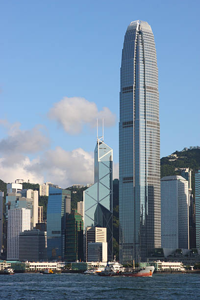 Sky line across water of international finance center Bank of China Tower and International Finance Center in Hong Kong. the bank of china tower stock pictures, royalty-free photos & images