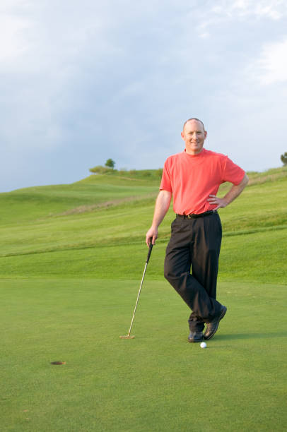 Golfer on the green 2 stock photo