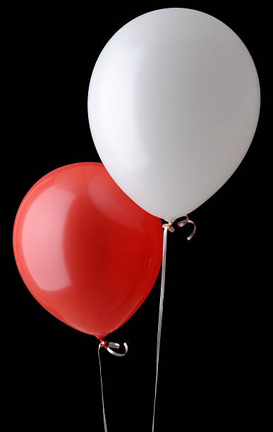 Red and White Balloons Isolated On Black Background stock photo