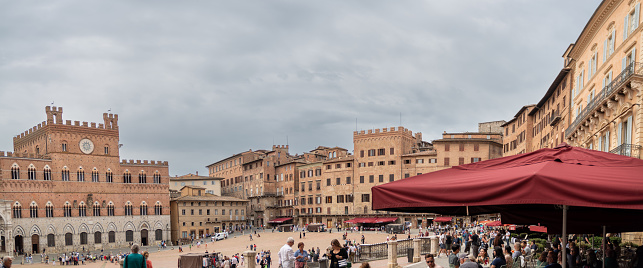 Panoramic image of the Crowded Siena square in Tuscany - Italy