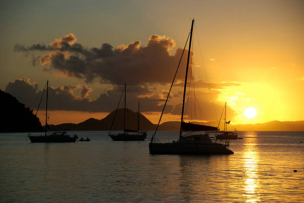 istock Golden Sun Sailboat Silhouette 172873485