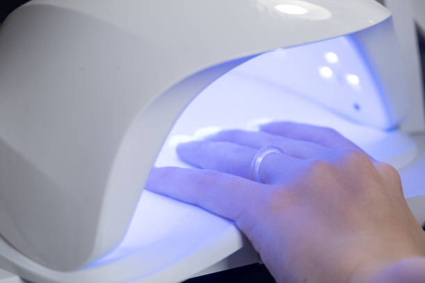 istock Female hands and tools for manicure, process of performing manicure 1728739451