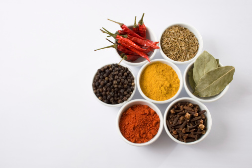 Spice box Indian masala dabba,indian spice box on wooden,Cardamom, turmeric, chilli powder, salt,mustard seeds,cumin,blur background