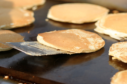 Pancakes on an outdoor griddle.