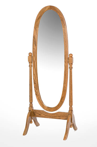 An oval oak full length mirror Oval oak dressing mirror. Free standing on white background. mirror object stock pictures, royalty-free photos & images