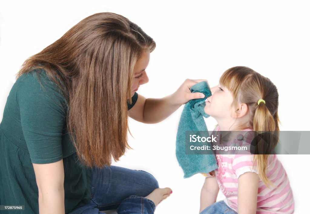 Caring Babysitter Series "A teenage girl is using a damp face cloth to wipe the face of a little girl.For more of my baby sitter series, please click here" 4-5 Years Stock Photo