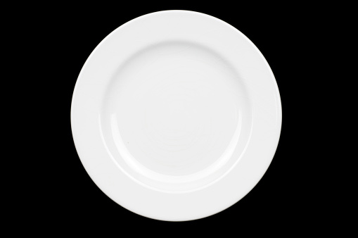 Whole white dinner plate centered on pure black background. See portfoloio for variations of same subject.