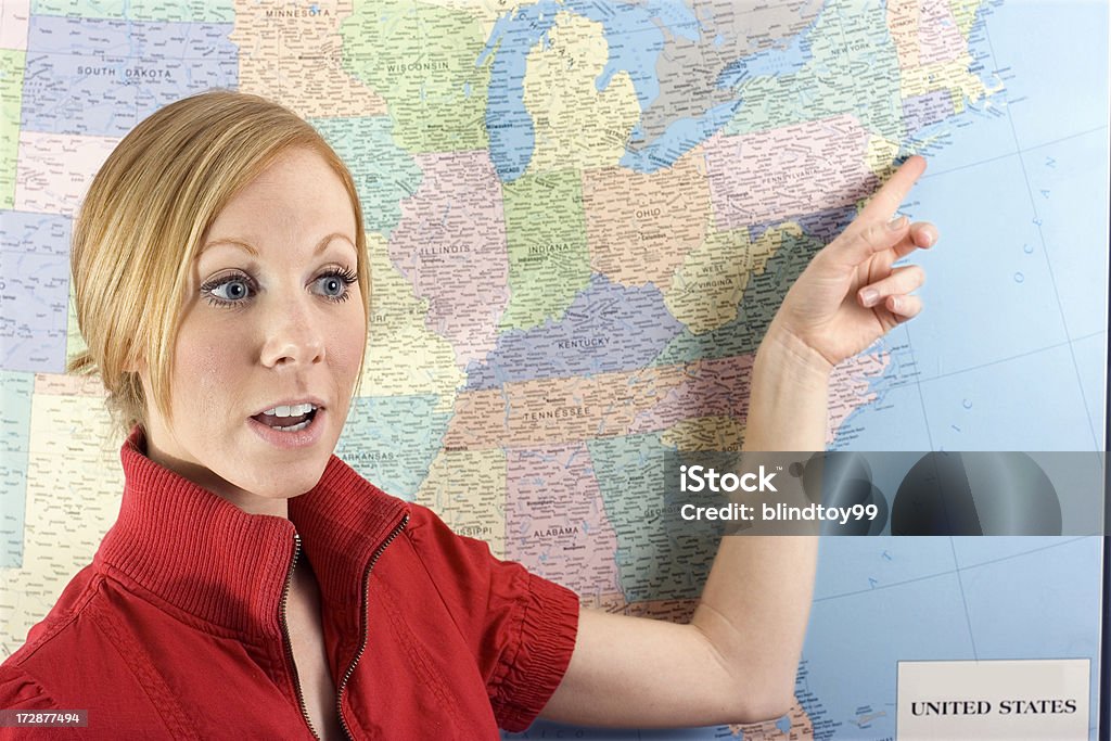 Pointing at New York City on a map A woman pointing to New York City on a map. Adult Stock Photo