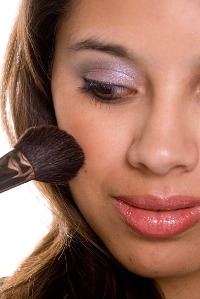 Latin Woman putting on blush close-up.[url=http://www.istockphoto.com/file_search.phpaction=file&lightboxID=3995958 t=_blank][img]http://digitalxposure.googlepages.com/cosmetics.jpg/cosmetics-medium;init:.jpg[/img][/url]