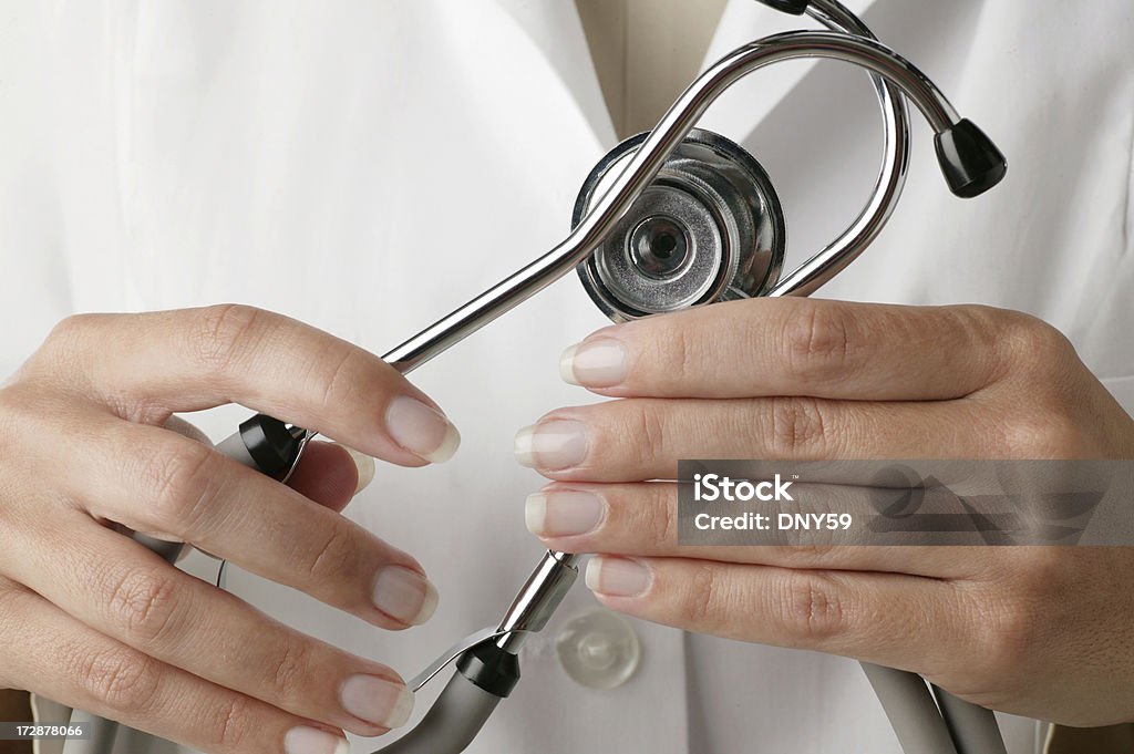 Stethoscope Doctor holding a stethoscope.To see more of my medical images click on the link below Accidents and Disasters Stock Photo