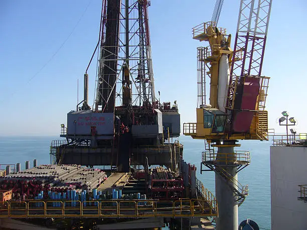 A chinese offshore oilrig with No smoking written across the front of the drilling derrick in both english and chinese charactersMore oil field images