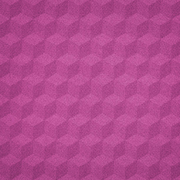 geometric cube pattern on pink paper stock photo