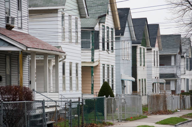 Inner City Neighborhood Line of houses on a street in an inner city neighborhood.Click on the banner below to see more photos like this. run down neighborhood stock pictures, royalty-free photos & images