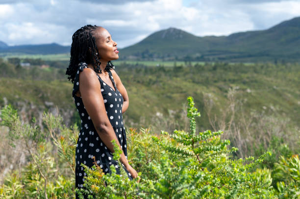 istock Woman seen standing and soaking in sun 1728836915