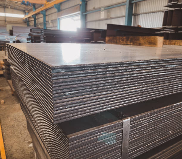 istock Steel sheets accumulate in piles. steel plate structure 1728846102