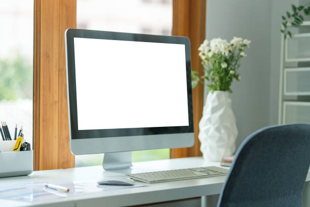 istock Comfortable workspace with blank screen comput and office supplies on a white wooden desk. 1728846663