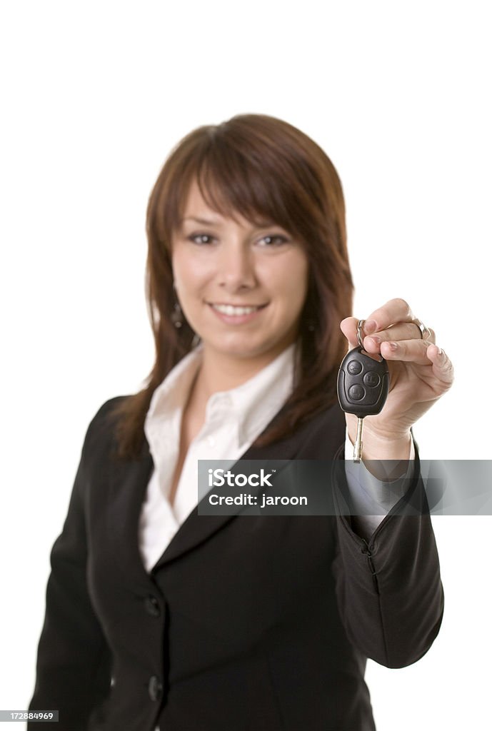 young attractive woman with car keys young attractive woman with car keys isolated on white (focused on keys) 20-24 Years Stock Photo