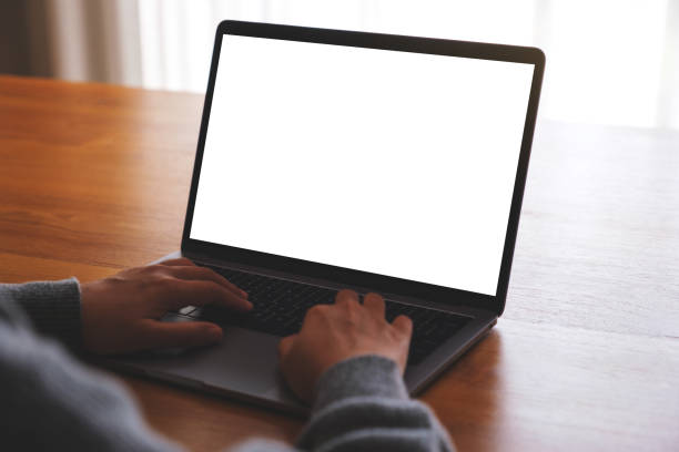 istock Mockup image of a woman using and working on laptop computer with blank white desktop screen 1728855208