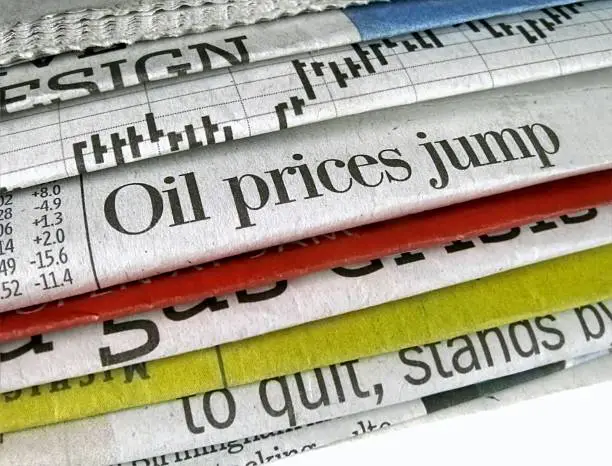 Newspaper headline "Oil prices jump"