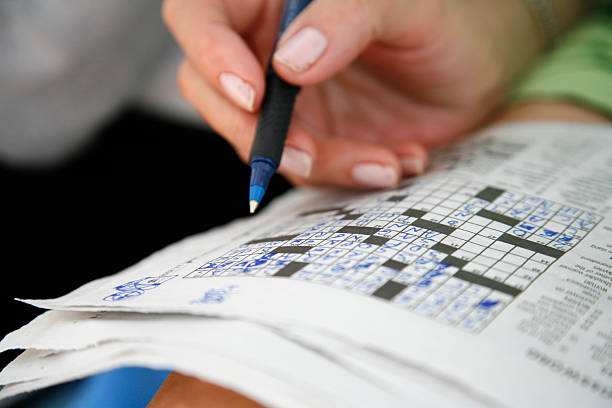 Doing the crossword puzzle stock photo