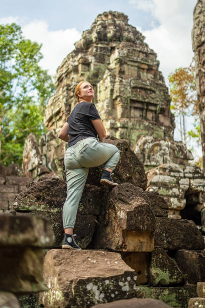 istock Young Redhead Girl Exploring Angkor Wat, Cambodia 1728871645
