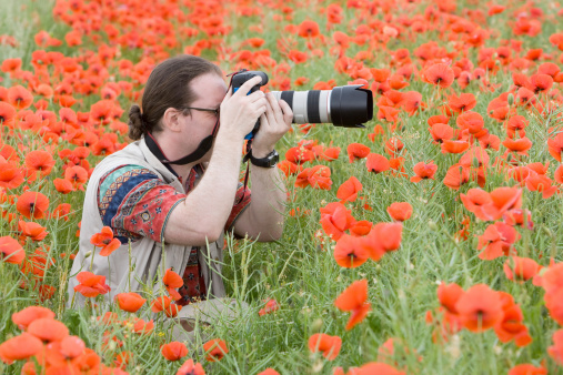 A friend of mine is making photos in a poppy field. RAW-file developed with Adobe Lightroom.