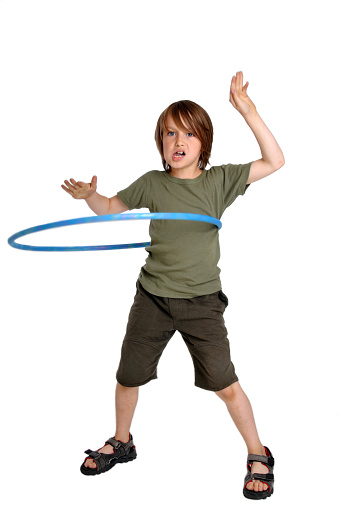 Boy with sandals playing with blue (hoola-)hoop.