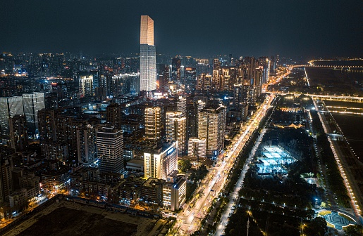 Wuhan, China – February 04, 2023: An aerial view of an urban street at night in Wuhan, China