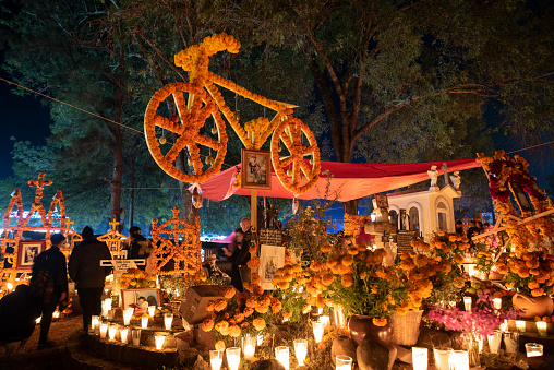 Tzintzuntzan,Michoacan; November 1 2022: Celebration of Day of the Dead with decoration of the cemetery and a candlelight vigil. One of the most important celebration in Mexico and the Lake Patzcuaro