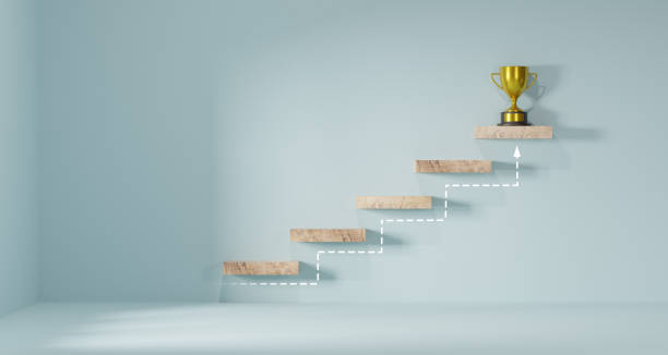istock Cube block staircase moving step growing up to target and award trophy on top. Success achievement or goal business motivation. step Action plan. 1728927300