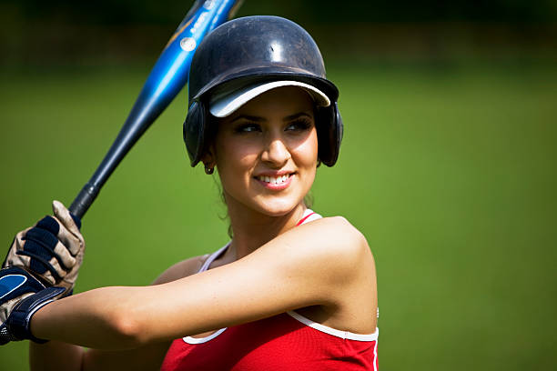 Baseball "Woman playing baseball, space for copy, canon 1Ds mark III" baseball helmet stock pictures, royalty-free photos & images