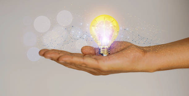 istock Creative solution or idea for web banner design or landing page template for creative agency with hands coming out of the screen with light bulbs and colorful abstract geometric shapes and lead lines. 1728954418