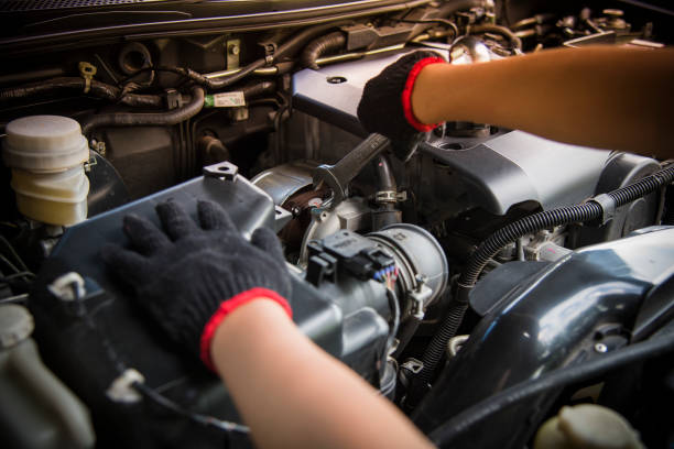 istock Car service ,fitting a car engine with wrench 1728954440
