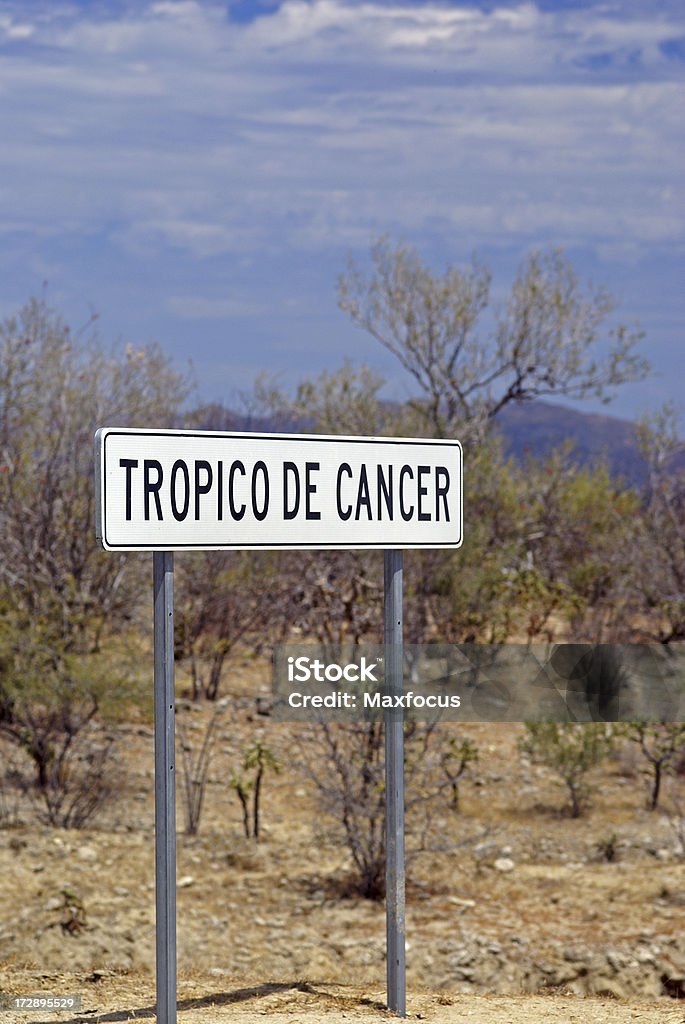 Tropic of Cancer Sign A sign alone the road marks the location of the Tropic of Cancer, or Northern tropic on the Baja Peninsula of Northern Mexico. Baja California Peninsula Stock Photo