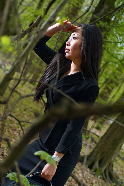 istock Businesswoman in a Forest Looking Out 172896363