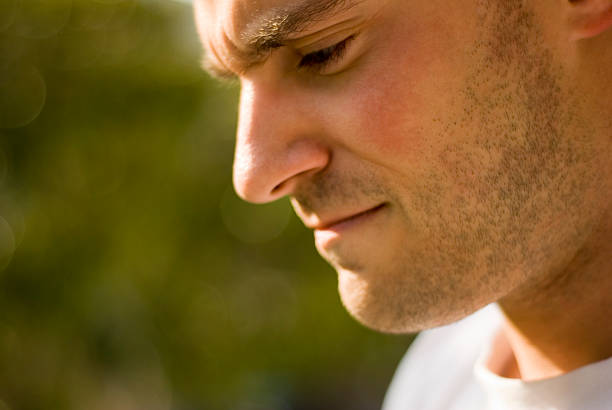 istock Close up of a man's face with beard looking downward 172896653
