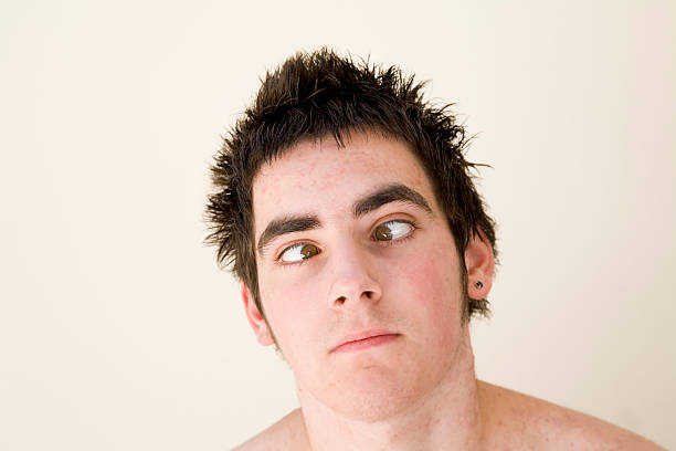 cross-eyed teen - making a face cross eyed teenager teenage boys stock-fotos und bilder