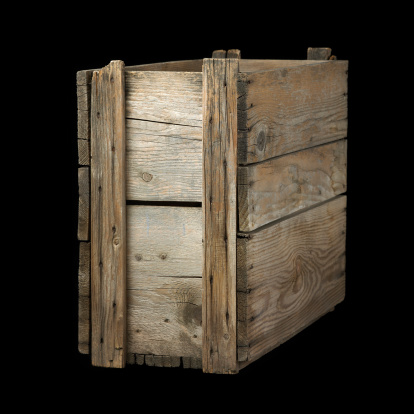 Old wooden crate isolated on black