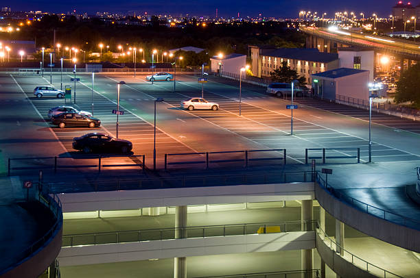 Car Park at Night A nightime city centre multi-storey parking lot stock pictures, royalty-free photos & images
