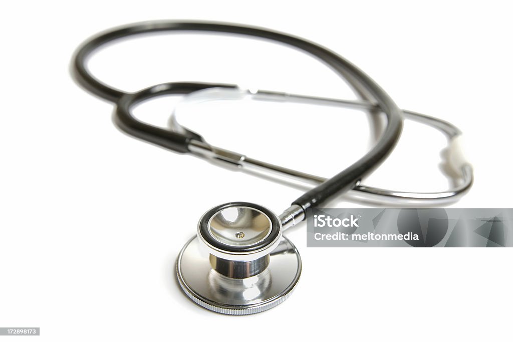 Closeup of a stethoscope isolated on white background Stethoscope isolated on white. Accidents and Disasters Stock Photo