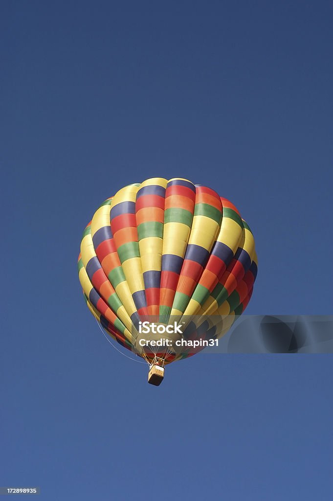 Single Hot Air Balloon Single hot air balloon in flight taken from below against a brilliant blue sky - there is plenty of copy space on all sides Alertness Stock Photo