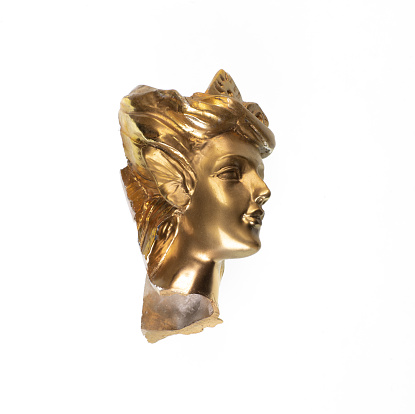 golden head of female statue isolated on white background
