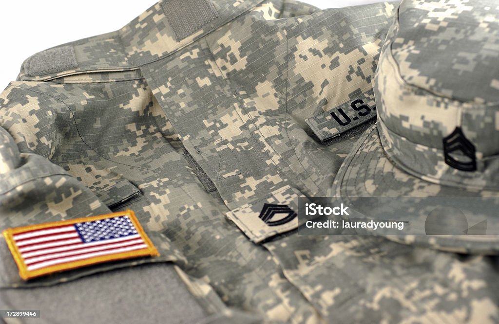 U.S. Army Combat Uniform and Cap "The Army Combat Uniform (ACU) uses a new military camouflage pattern called the Universal Camouflage Pattern (UCP), which blends green, tan, and gray to work effectively in desert, and urban environments. Flag and rank patches attach with velcro.  This uniform features the rank insignia of a United States Army Sergeant First Class." Nylon Fastening Tape Stock Photo
