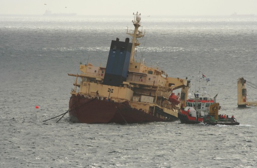 A shipwreck being salvaged.