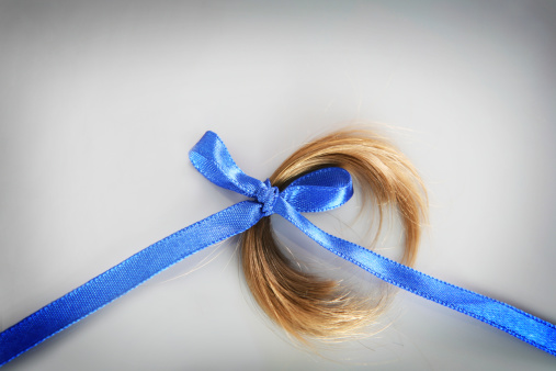 lock of hair with ribbon