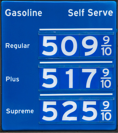 Chicago, IL, USA, November 20, 2023, Mobil gas station at night, cars refueling under fluorescent lights, urban scene, convenience, transportation, and energy services, inflation rising oil gas prices